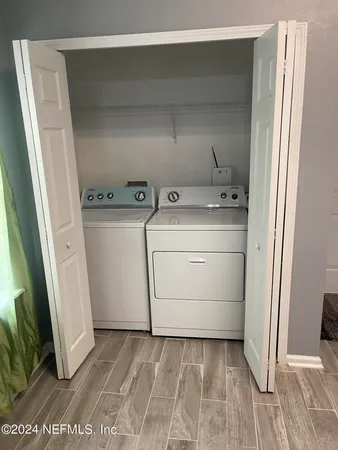 a utility room with dryer and washer