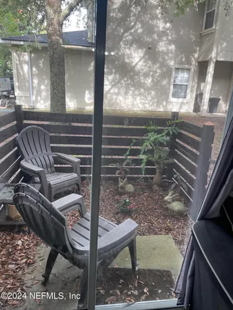 a view of barbeque area with seating area