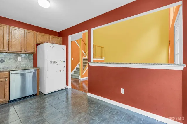 a view of a kitchen with a stove top oven