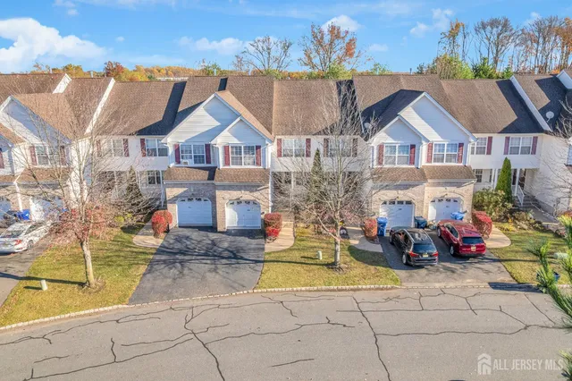 a view of multiple houses with a yard