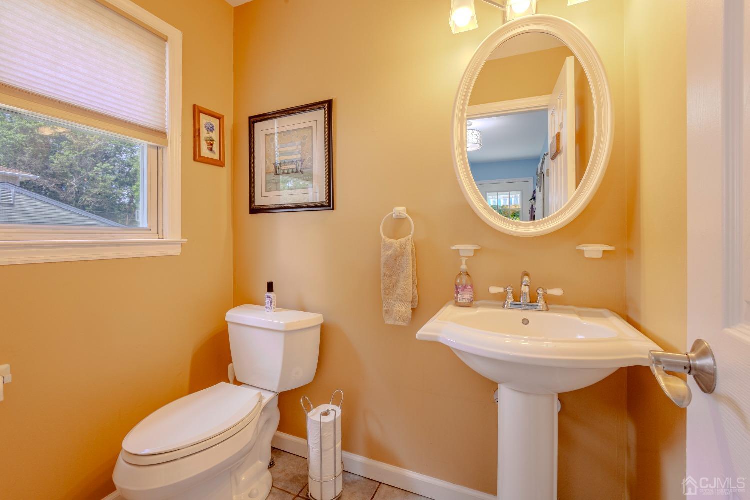 4 Putnam Road East Brunswick, NJ 08816 - Photo 21 of 53 a bathroom with a toilet sink and mirror