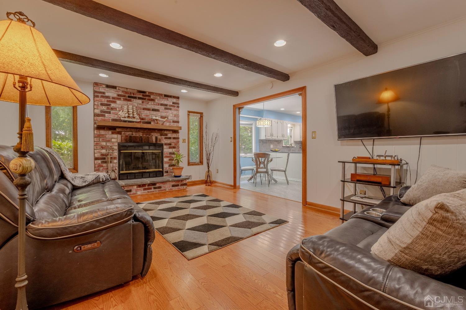 4 Putnam Road East Brunswick, NJ 08816 - Photo 22 of 53 a living room with furniture and a flat screen tv