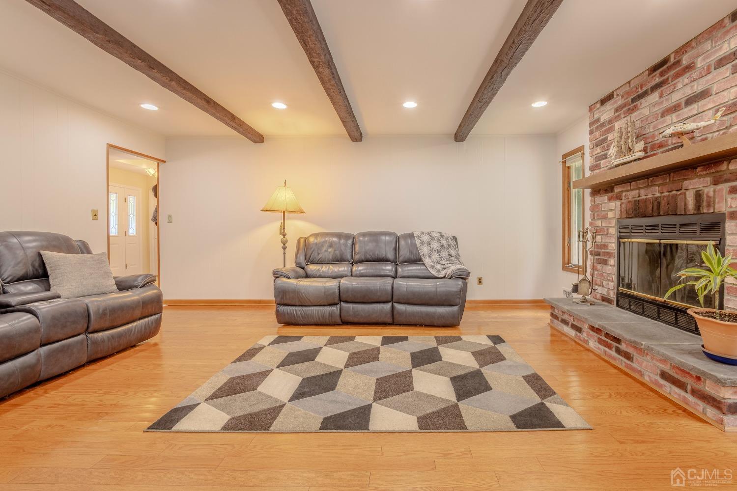 4 Putnam Road East Brunswick, NJ 08816 - Photo 23 of 53 a living room with furniture and a couch