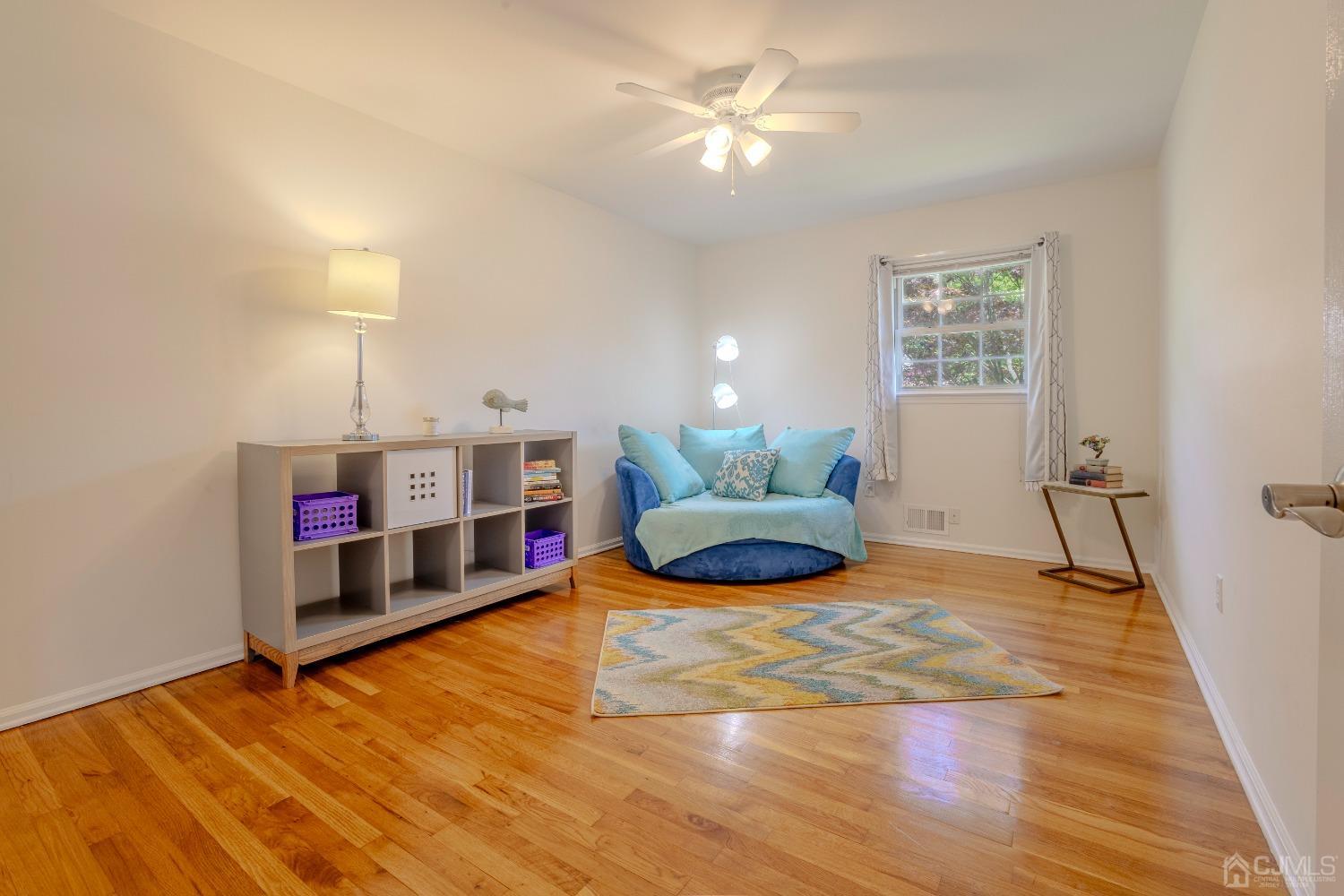 4 Putnam Road East Brunswick, NJ 08816 - Photo 28 of 53 a living room with furniture and a wooden floor