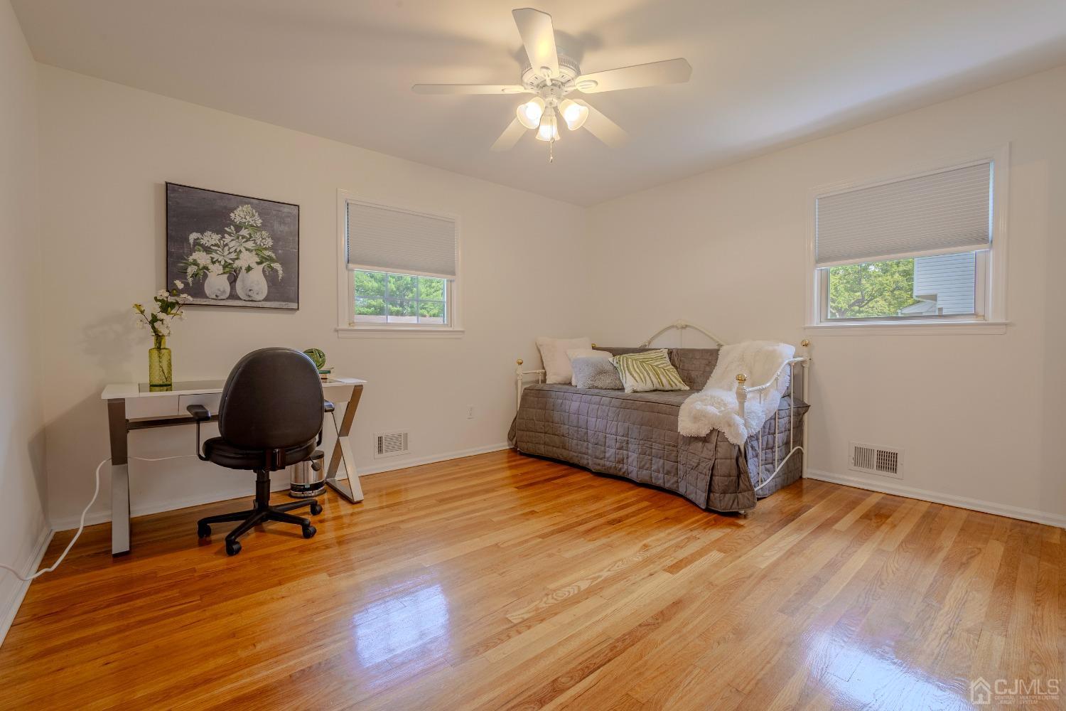 4 Putnam Road East Brunswick, NJ 08816 - Photo 30 of 53 a living room with furniture and a chair