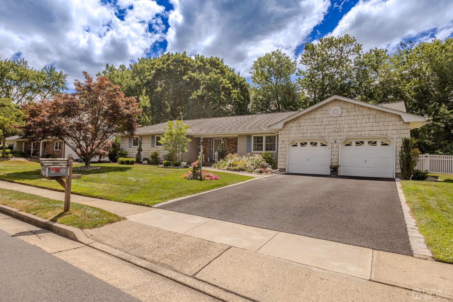 4 Putnam Road East Brunswick, NJ 08816 - Photo 3 of 53 a front view of a house with a yard