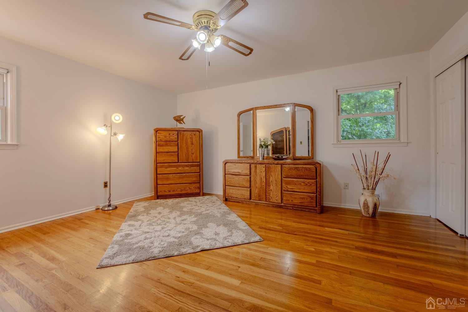 4 Putnam Road East Brunswick, NJ 08816 - Photo 32 of 53 a living room with furniture and a chandelier