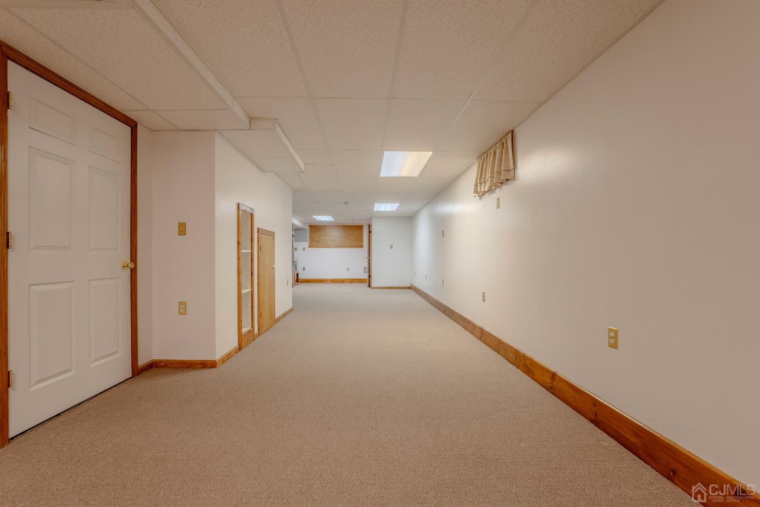 4 Putnam Road East Brunswick, NJ 08816 - Photo 37 of 53 a view of a hallway with wooden floor