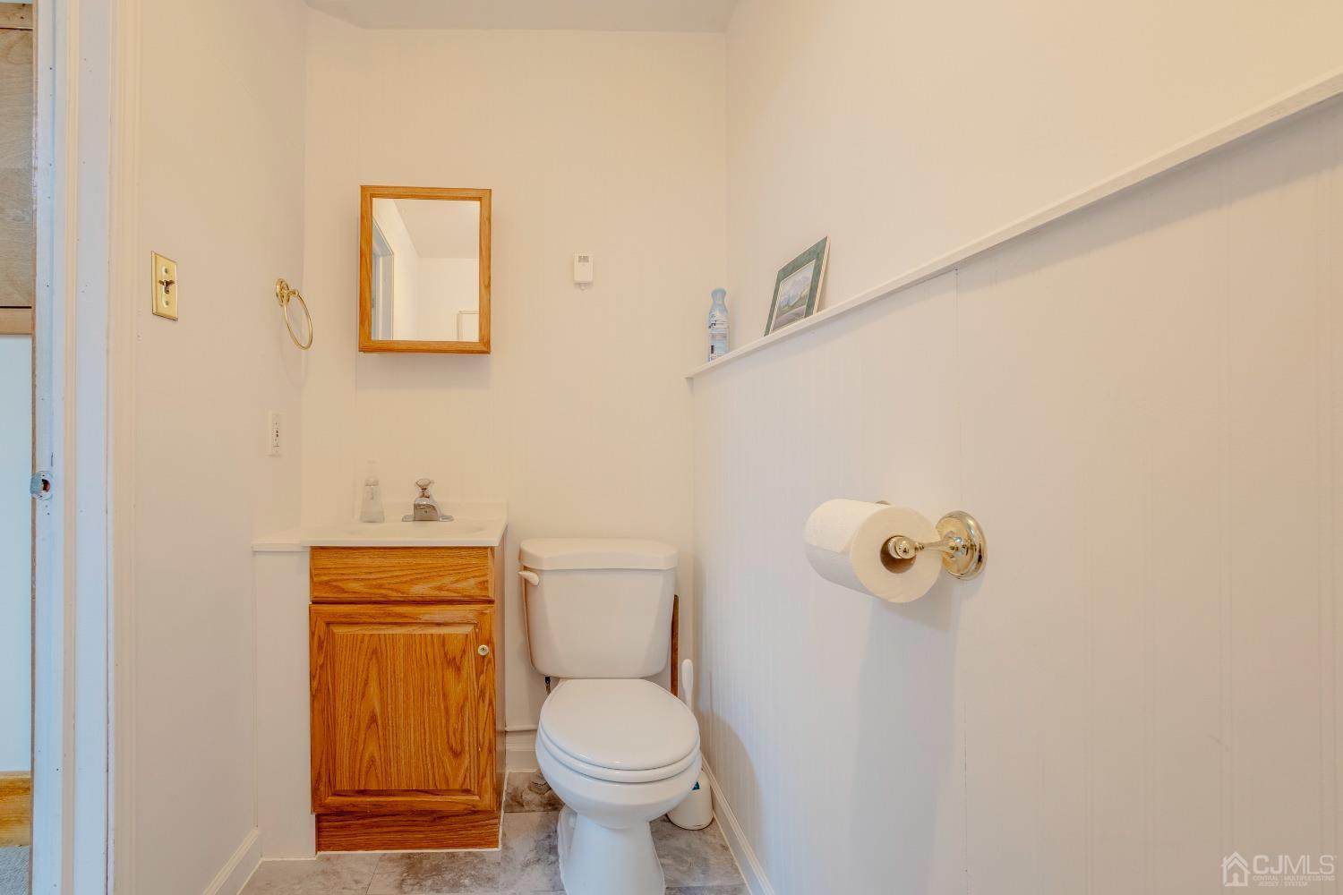 4 Putnam Road East Brunswick, NJ 08816 - Photo 41 of 53 a white toilet sitting next to a bathroom sink