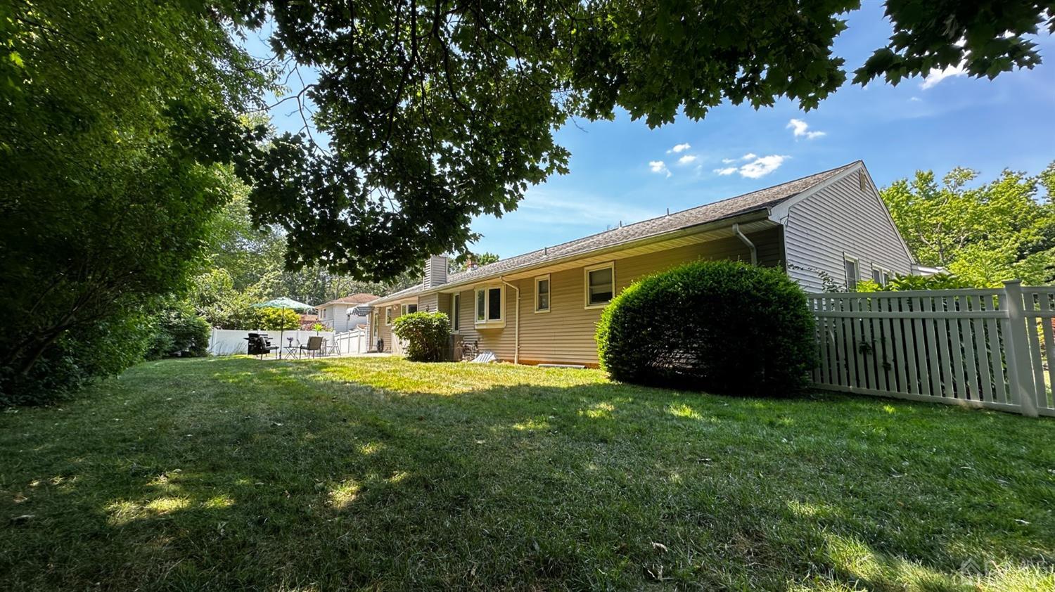 4 Putnam Road East Brunswick, NJ 08816 - Photo 48 of 53 a view of a house with a yard and potted plants