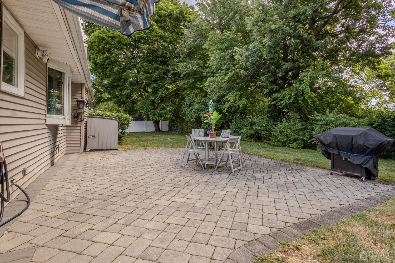 4 Putnam Road East Brunswick, NJ 08816 - Photo 49 of 53 a lawn chairs sitting in a backyard of a house