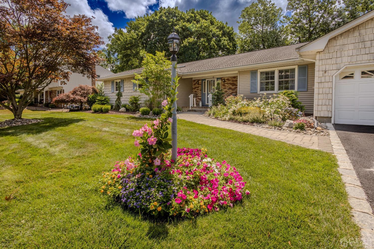 4 Putnam Road East Brunswick, NJ 08816 - Photo 5 of 53 a view of a house with a big yard and potted plants