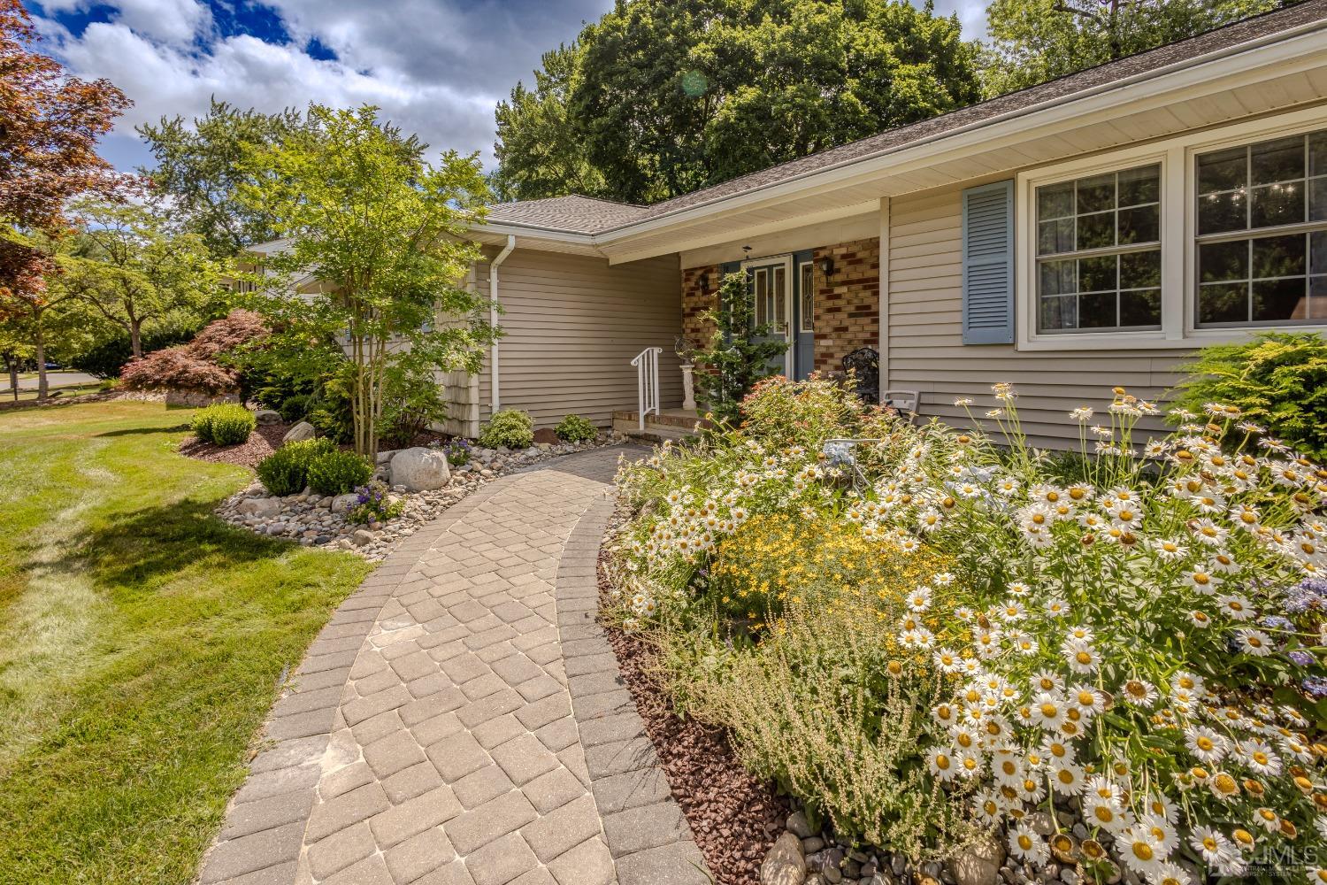 4 Putnam Road East Brunswick, NJ 08816 - Photo 7 of 53 a front view of a house with garden