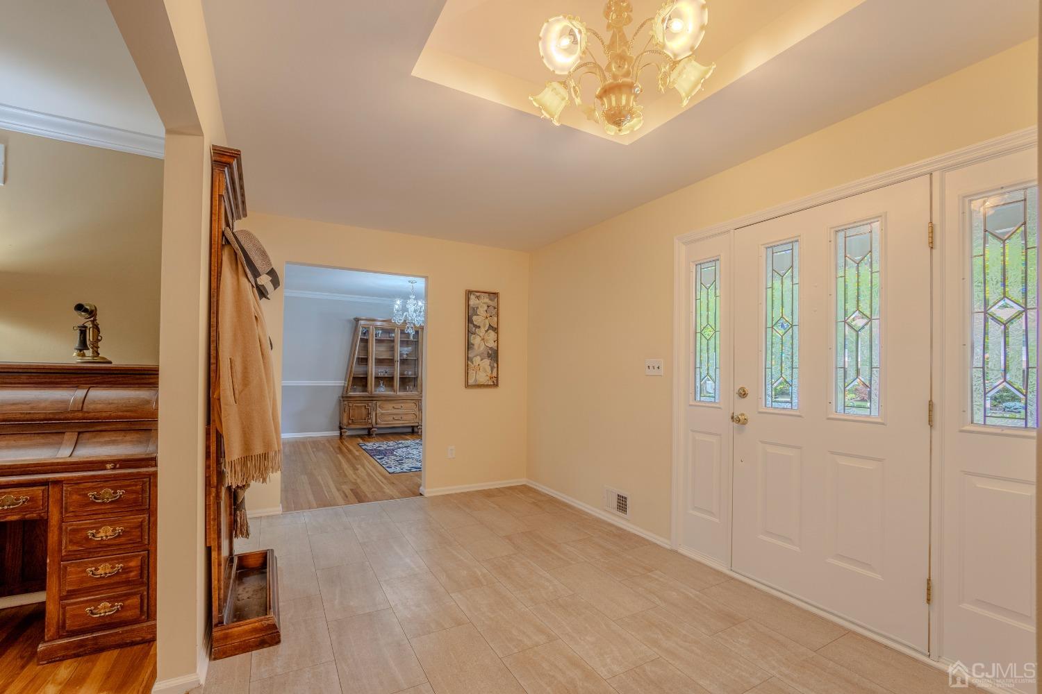 4 Putnam Road East Brunswick, NJ 08816 - Photo 8 of 53 a view of a livingroom with a furniture and chandelier