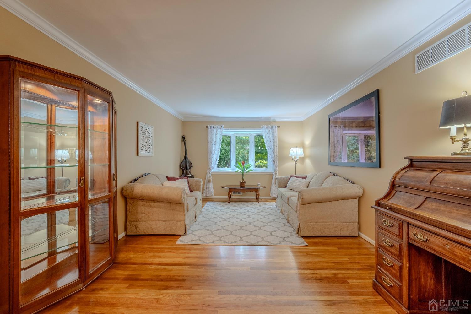 4 Putnam Road East Brunswick, NJ 08816 - Photo 9 of 53 a living room with furniture and a fireplace