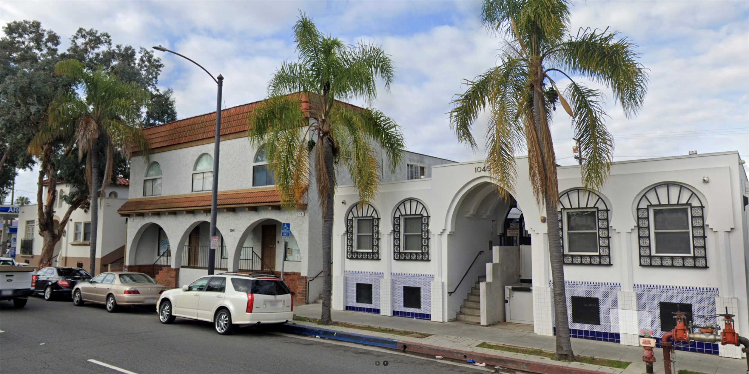 1027 Redondo Avenue Long Beach, CA 90804 - Photo 3 of 8 a couple of cars parked in front of a building