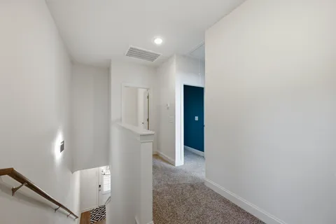 a view of a balcony with wooden floor