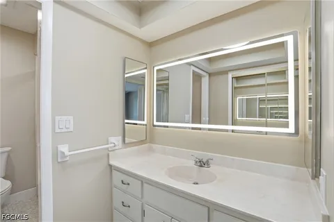a bathroom with a shower and a toilet