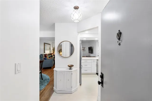 a view of a hallway with washer and dryer