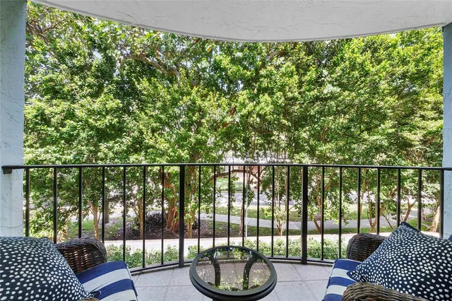 a view of a balcony with lake view and a floor to ceiling window