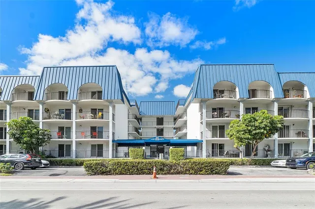 a front view of a building with street view