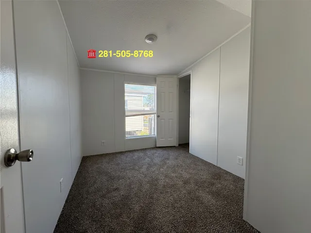 a view of empty room with windows