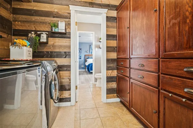 a kitchen with refrigerator and window