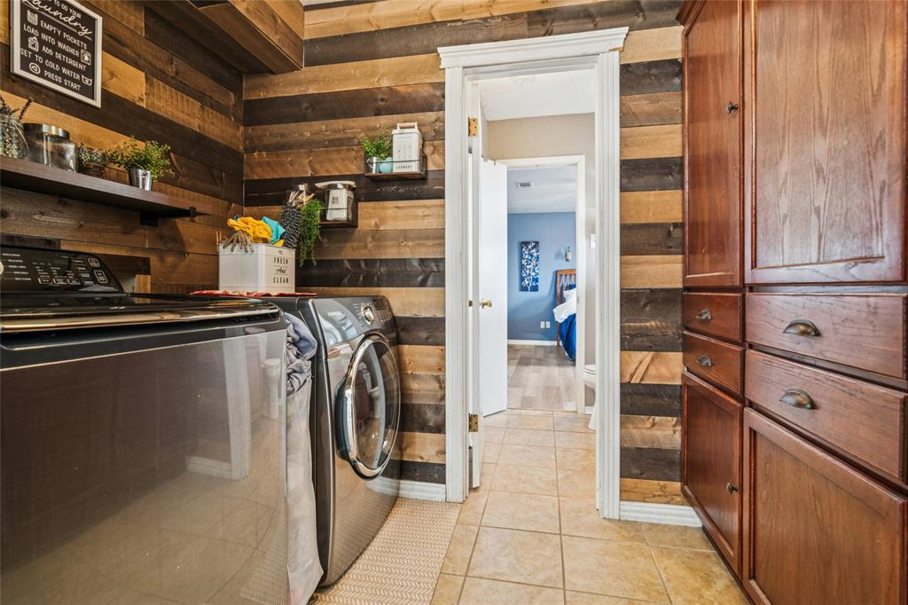 903 Houston Street Anna, TX 75409 - Photo 24 of 27 a view of a refrigerator and storage area