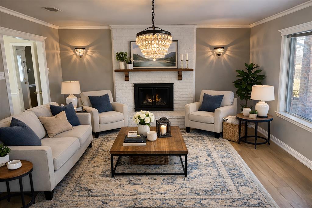 903 Houston Street Anna, TX 75409 - Photo 5 of 27 a living room with furniture a chandelier and a fireplace