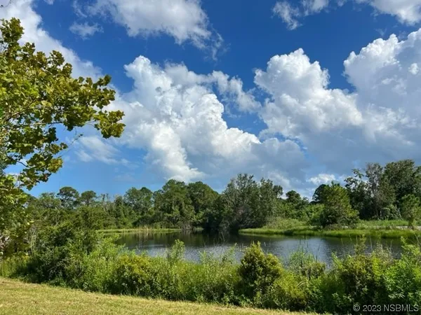 a view of a lake with a yard