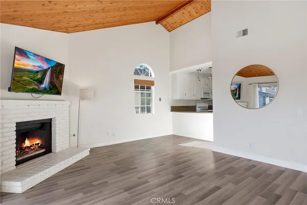 a view of a kitchen with furniture and a fireplace