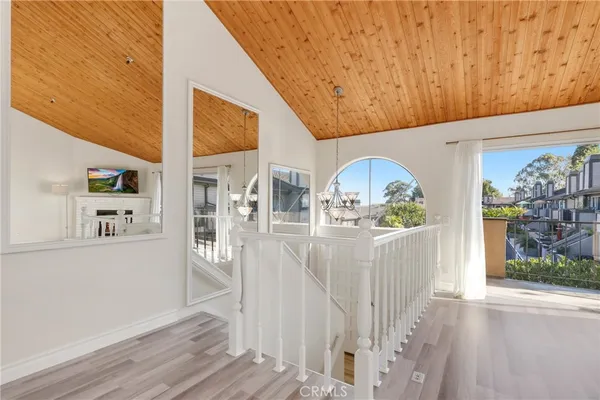 a view of living room with furniture and wooden floor