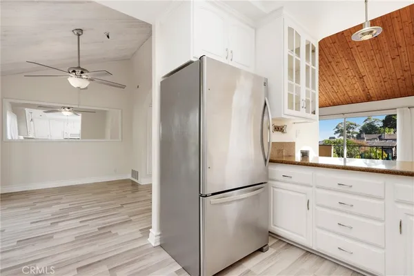 a white refrigerator freezer sitting inside of a kitchen