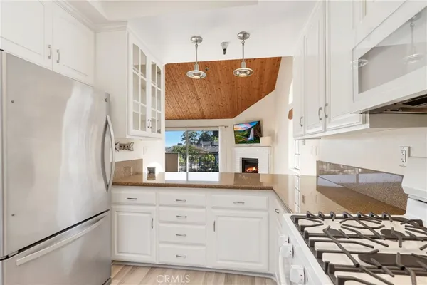 a view of kitchen with stainless steel appliances cabinets and a counter top space