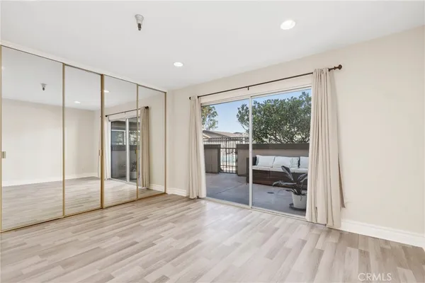 a room with wooden floor and furniture