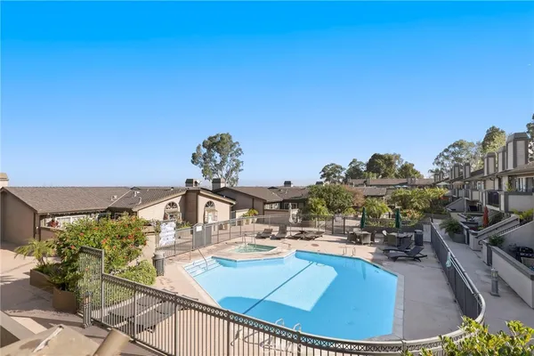 a view of a swimming pool with an outdoor seating