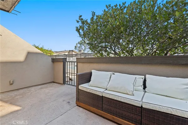 a view of a balcony with two chairs