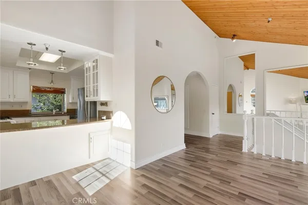 a view of a living room with hardwood floor