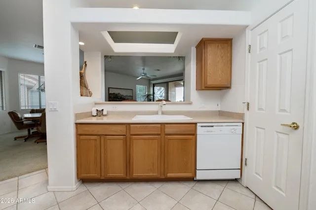 a spacious bathroom with a double vanity sink and a mirror