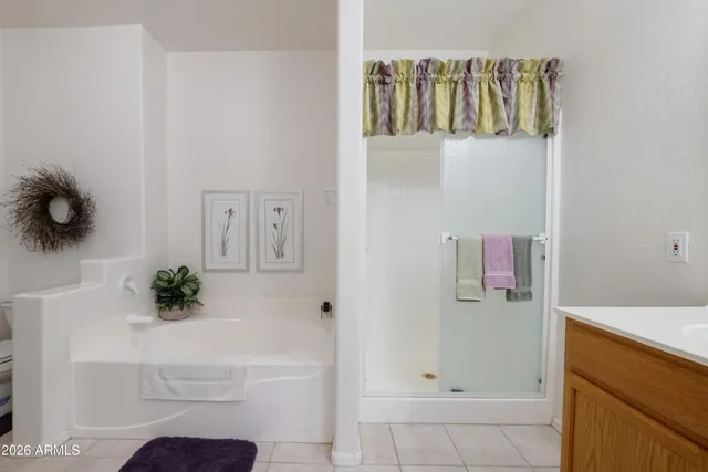a bathroom with a bathtub and shower