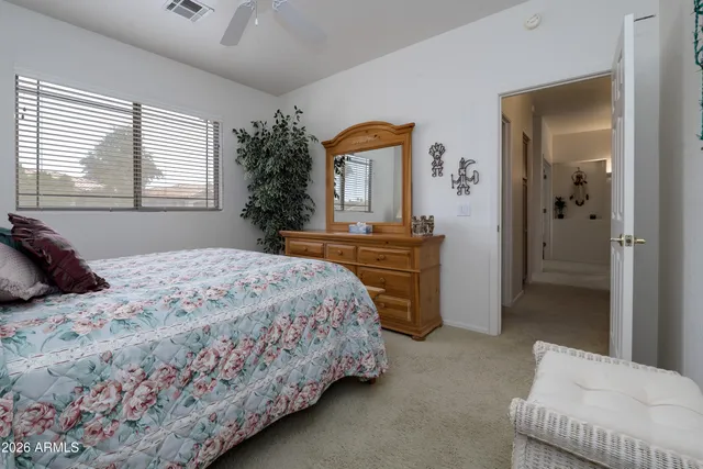 a bedroom with a bed and a dresser