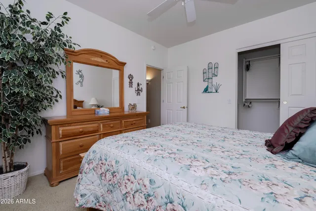 a bedroom with a bed and a dresser