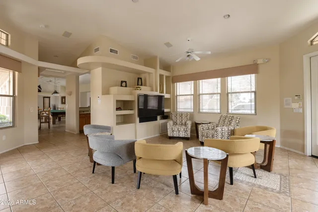 a living room with furniture and a large window