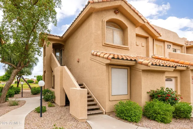 a front view of a house with stairs