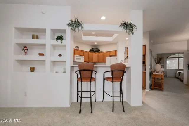 a view of hall way with furniture and closet