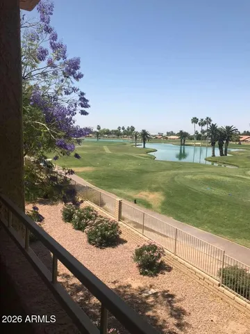 a view of a street with a lake view
