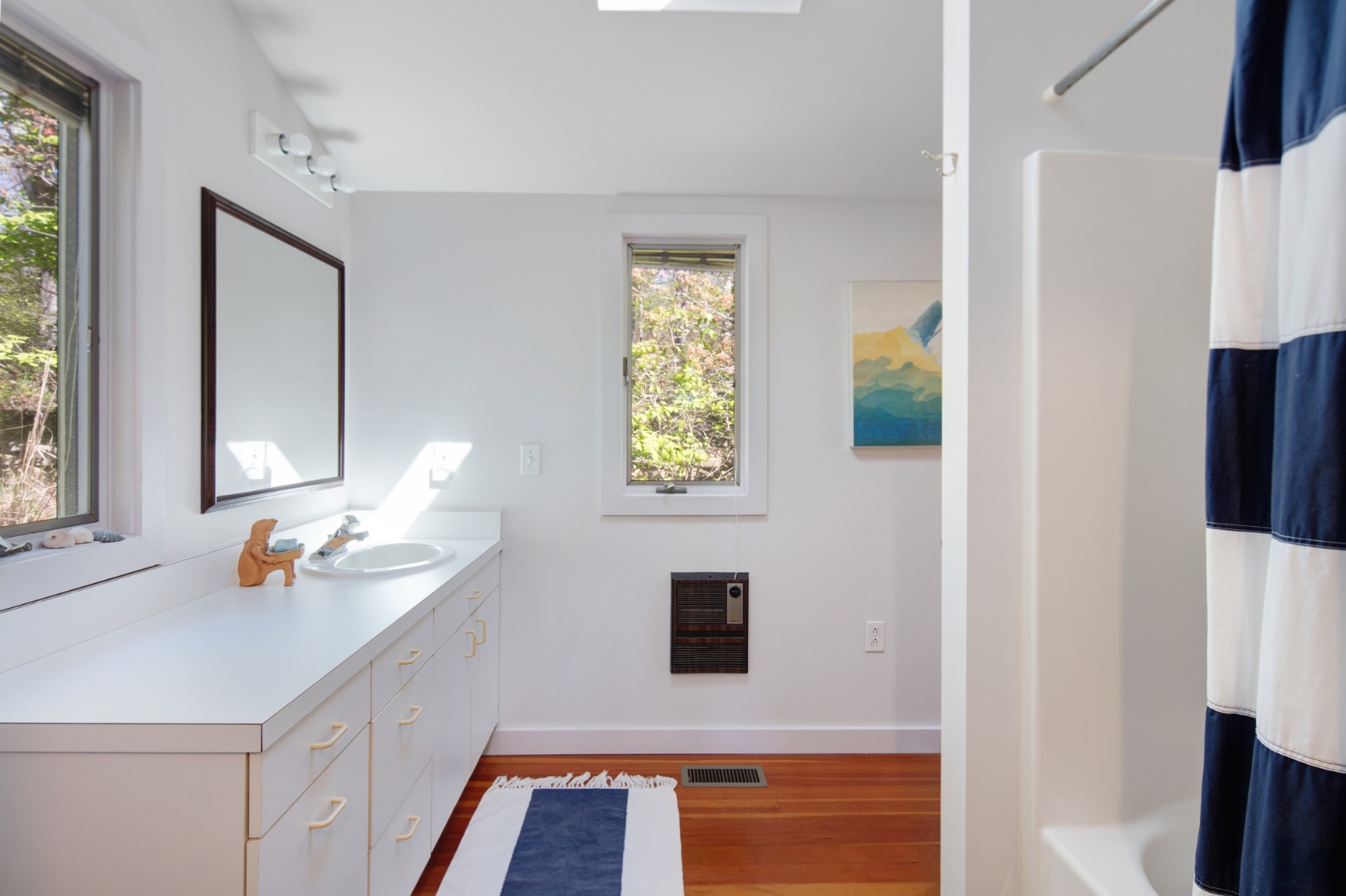 10 Abel's Neck Road Chilmark, MA 02535 - Photo 9 of 20 a bathroom with a sink and a mirror