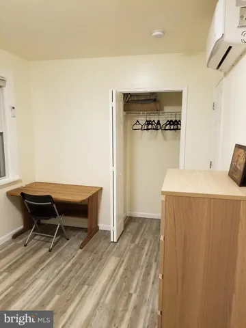 a bedroom with a bed and a table