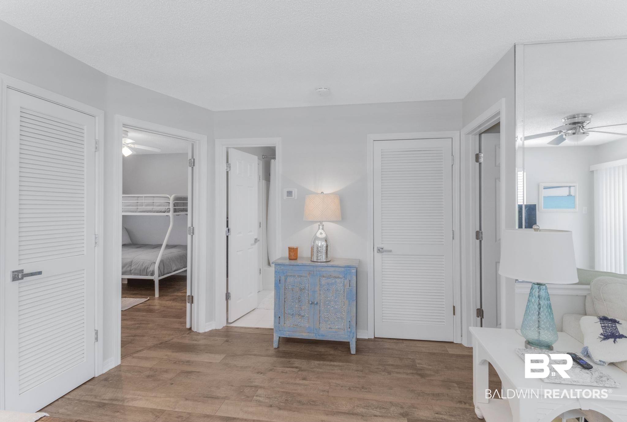 25957 Canal Road, Unit 306 Orange Beach, AL 36561 - Photo 16 of 28 Interior space with light wood-type flooring, two closets, and ceiling fan