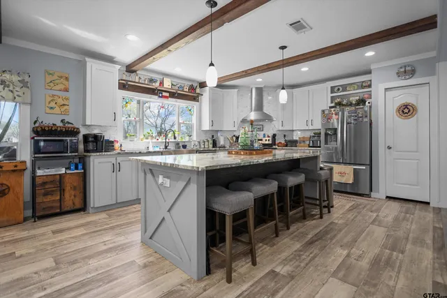 a work room with furniture and a flat screen tv